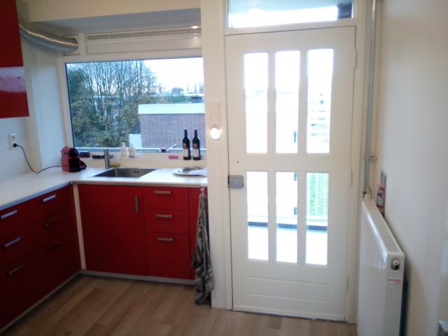 muur weggehaald tussen keuken en gang